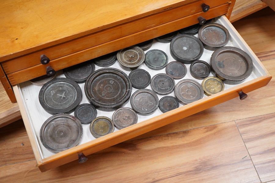 A collection of mainly 16th century to 19th century bronze and lead imperial circular trade weights, stamped with Royal Cyphers, weights, the dagger assay mark for London, other proof marks, etc., together with a few Geo
